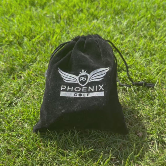 Velvet drawstring bag with phoenix logo on being opened up showing phoenix golf tour tees