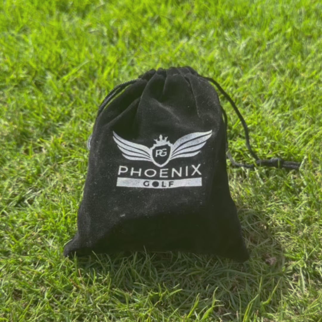 Velvet drawstring bag with phoenix logo on being opened up showing phoenix golf tour tees